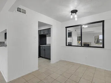 Dining area beside the kitchen and mirrored pass-through